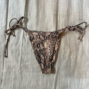 Snake print tie side bottoms more on the cheeky side but there is a little cover